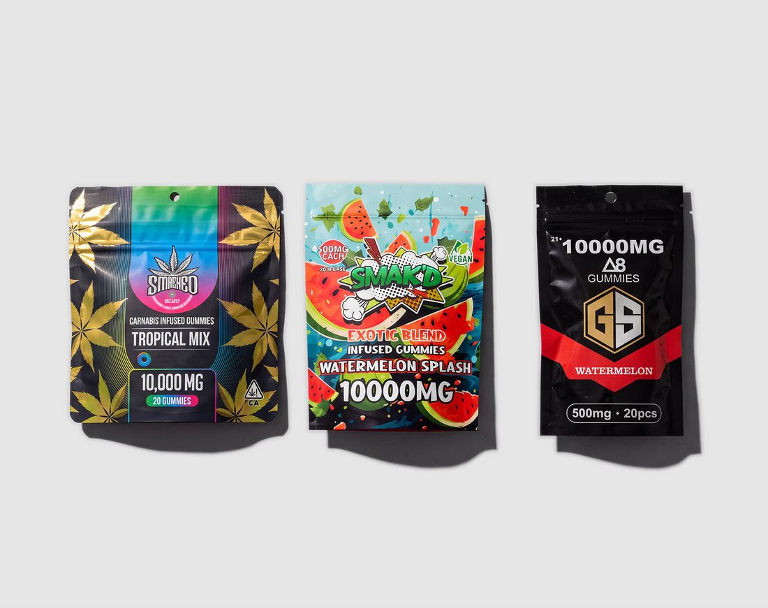 Three hemp gummy packs photographed on grey, each advertising 10,000 mg on the front.