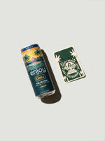 Canned drink with a tropical design next to a card featuring a Buddha illustration on a light gray background
